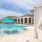 Resort-style swimming pool with lounge seating