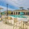 Resort-style swimming pool with lounge seating